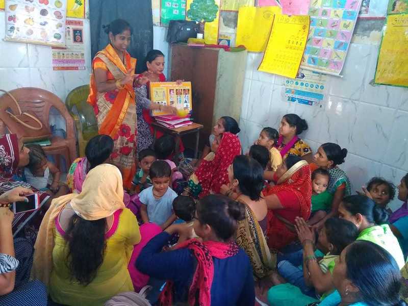 Poshan mitras with mothers of children under 5 years